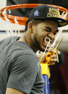 Mar 28, 2015; Cleveland, OH, USA; Kentucky Wildcats forward Trey Lyles (41) holds a piece of net in his mouth after the game against the Notre Dame Fighting Irish in the finals of the midwest regional of the 2015 NCAA Tournament at Quicken Loans Arena. Kentucky won 68-66. Mandatory Credit: Rick Osentoski-USA TODAY Sports